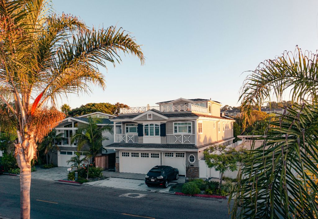 A welcoming, pool-free SoCal Community Homes residence exterior with palm trees
