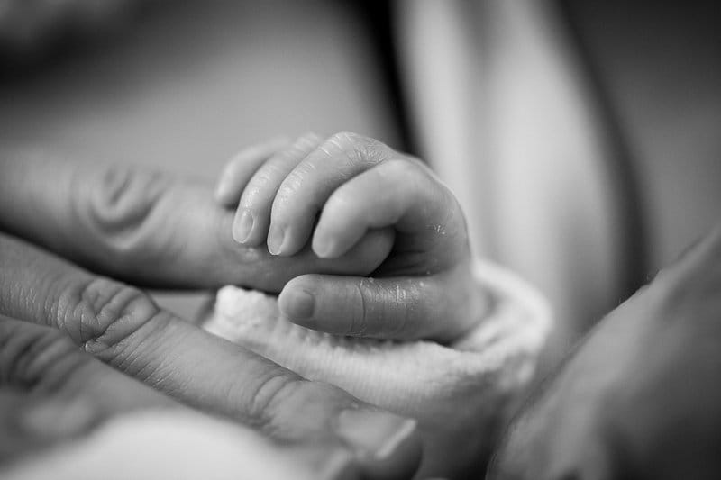 Newborn baby representing the maternity housing program